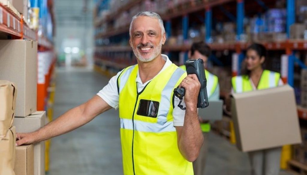 factory working posing for a picture | Consolidated Strategy Group